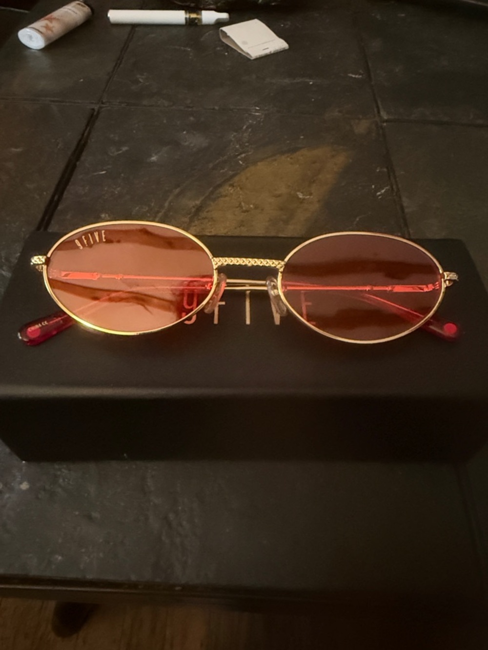 Gold Frame Oval Sunglasses with Red Lenses